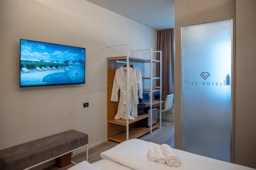 Postel nebo postele na pokoji v ubytování Ile Hotel