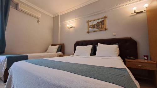 Ένα ή περισσότερα κρεβάτια σε δωμάτιο στο Elite Hotel City Center Corlu Bed and Breakfast