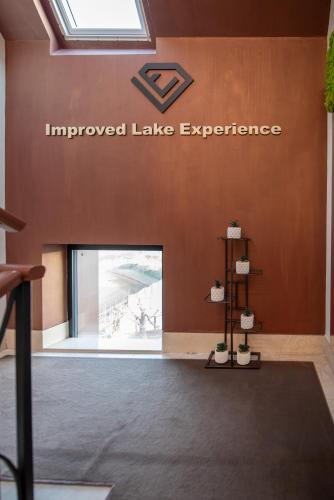 anointed lake experience sign on the wall of a building at Ile Hotel in Peschiera del Garda