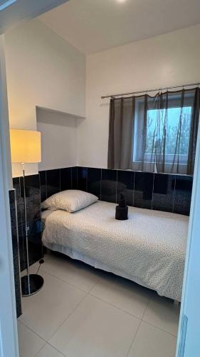 a bedroom with two beds and a window at AZYL in Legnica