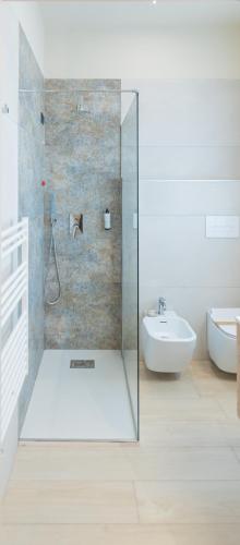 a bathroom with a glass shower and a sink at Ile Hotel in Peschiera del Garda