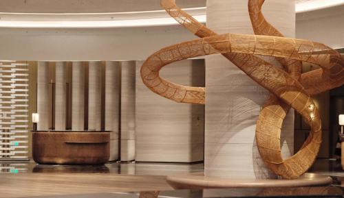 a sculpture of a pretzel on a wall in a lobby at Beihai Marriott Resort in Beihai