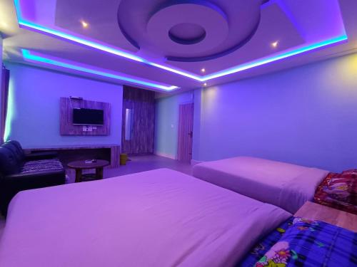 Ένα ή περισσότερα κρεβάτια σε δωμάτιο στο La Haven Guest House