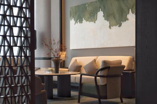 a living room with a couch and a table at Beihai Marriott Resort in Beihai