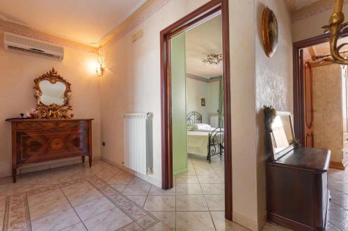 a room with a hallway with a mirror and a bathroom at Casa Pireddu by BarbarHouse in Castro di Lecce