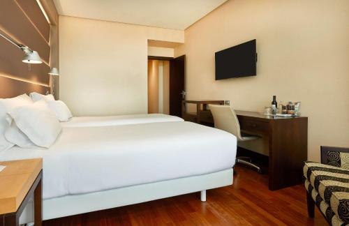 Katil atau katil-katil dalam bilik di NH Sevilla Plaza de Armas
