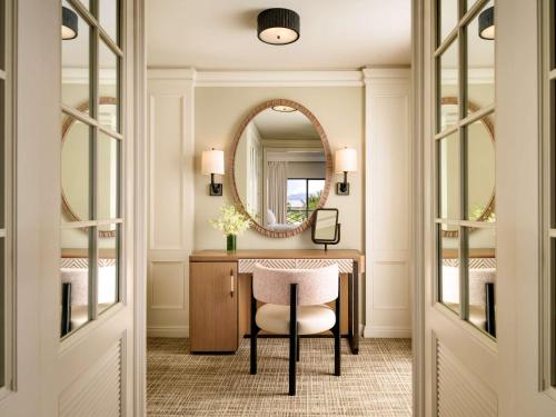 a dressing room with a table and a mirror at Fairmont Orchid in Waikoloa