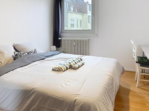 Postel nebo postele na pokoji v ubytování Bright apartment 10 min from Lille 4 people