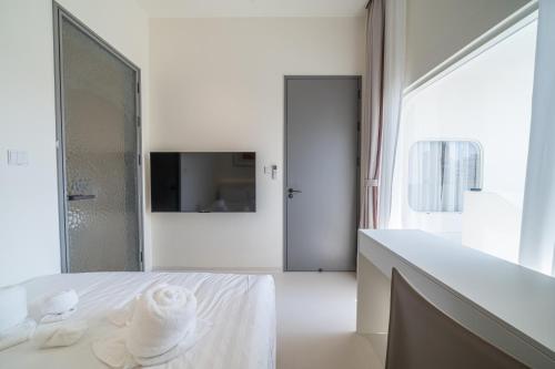 Ένα ή περισσότερα κρεβάτια σε δωμάτιο στο Pattaya Interstellar Village Resort House