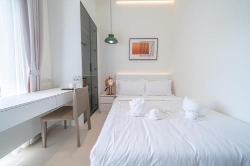 Ένα ή περισσότερα κρεβάτια σε δωμάτιο στο Pattaya Interstellar Village Resort House