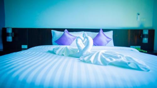 Aziss Boutique Hotel - SHA Plusにあるベッド