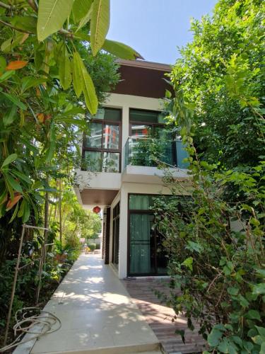 Zahrada ubytování Palmeraiebeach Resort Rayong ปาล์มมาลี บีช รีสอร์ท ระยอง 罗勇棕榈树海滩酒店