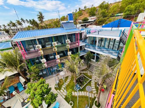 an overhead view of a building with palm trees at Rainbow Beach Mũi Né - Homestay & Coffee in Ấp Khánh Phước (1)