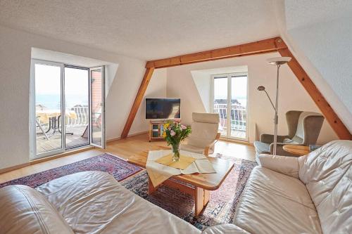 a living room with a couch and a table at Gästehaus Schiff in Meersburg