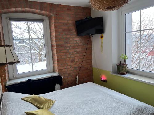 Posteľ alebo postele v izbe v ubytovaní Apartament u Kasi