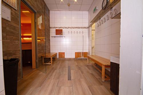 an empty room with benches and a basketball court at Vienna Sporthotel in Vienna