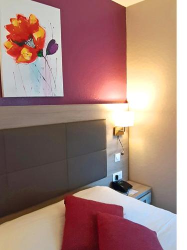 Ένα ή περισσότερα κρεβάτια σε δωμάτιο στο Hôtel & Appartements Le Florence
