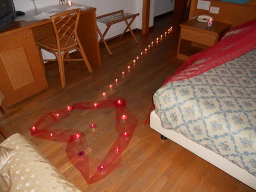 a room with a glass table with lights on it at Hotel Cavalieri in Passignano sul Trasimeno