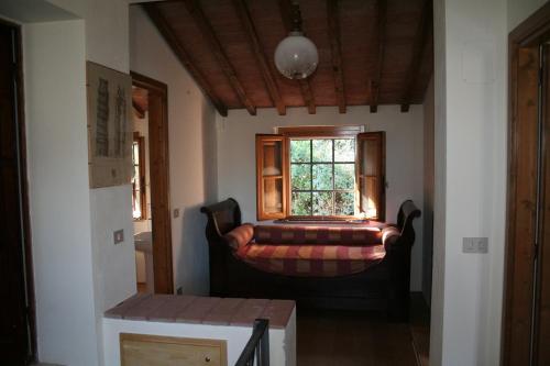 Ένα ή περισσότερα κρεβάτια σε δωμάτιο στο Casa di Campagna in Toscana