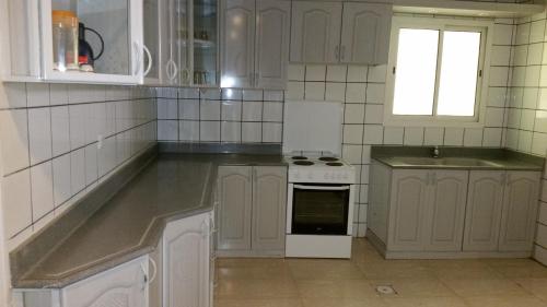 Kjøkken eller kjøkkenkrok på Mkani Apartment