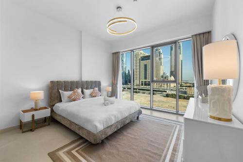 Krevet ili kreveti u jedinici u okviru objekta Magnificent - New 1BR in Canal Front Residences