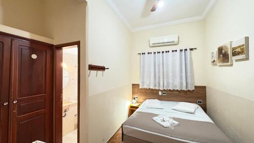 Postel nebo postele na pokoji v ubytování Hotel Casa Grande Orlândia SP