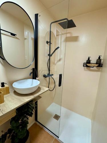 a bathroom with a sink and a shower at Casa Palmera in Sueca