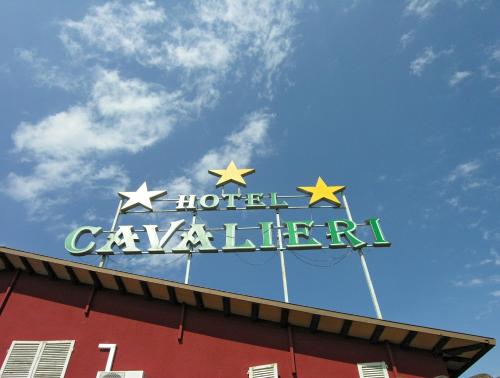 a sign on the top of a hotel calgary sign at Hotel Cavalieri in Passignano sul Trasimeno