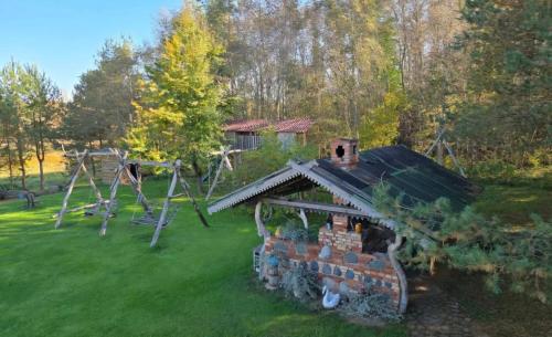an aerial view of a house with a playground at Sodyba Pas Juzi in Alanta