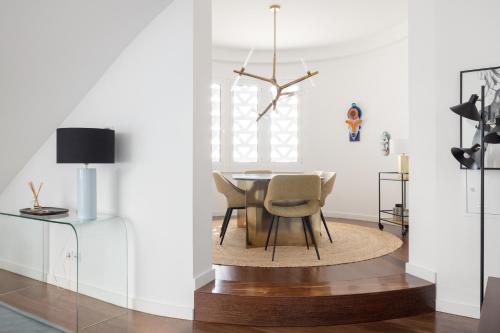 a dining room with a table and chairs at Deco Gem in City Center in Lisbon