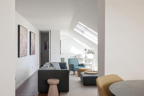 a living room with a couch and chairs at Deco Gem in City Center in Lisbon