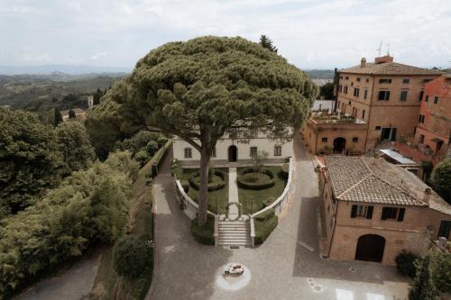 an aerial view of a building with a large tree at Borgo Bucciano in San Miniato