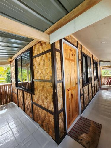 an inside view of a tiny house with a door at JFive Homes by the Sea in Lianga