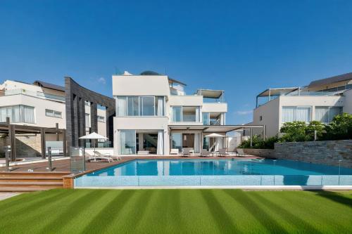 an image of a villa with a swimming pool at Beachfront Luxury Villa Glory in Ayia Napa
