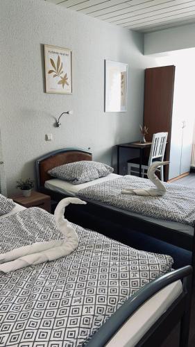 two beds sitting next to each other in a room at Family and Friends Dannstadt in Dannstadt-Schauernheim