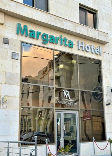 a store front of a mar expedia hotel at Margarita Hotel in Amman