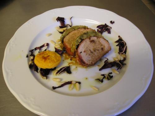 a white plate with a piece of food on it at Hotel Cavalieri in Passignano sul Trasimeno