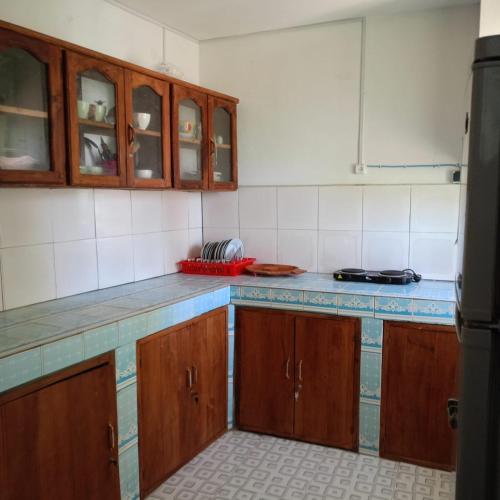 Kuchyň nebo kuchyňský kout v ubytování Appart'hôtel Chez les Zafifou