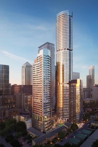 a group of tall buildings in a city at Dorsett Hotel Canary Wharf in London