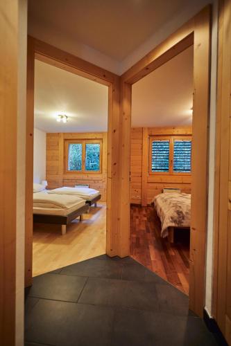 a bedroom with a bed and a bed sidx sidx sidx sidx at Au Vieux Champex in Champex