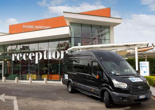 a black van parked in front of a store at Best Western Hotel Rome Airport in Fiumicino