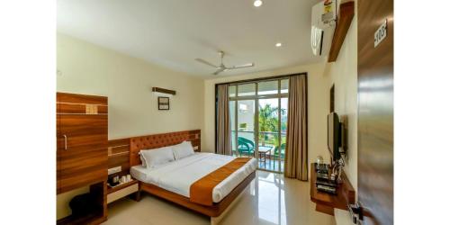 Hotel Sadhana Executiveにあるベッド