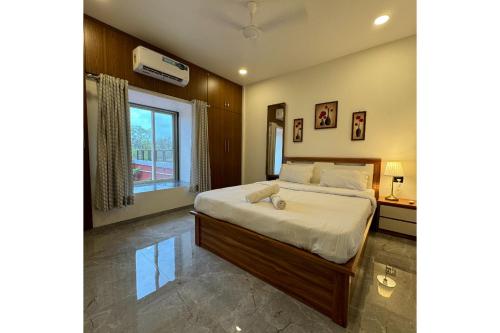 Hotel Sadhana Executiveにあるベッド