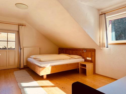 a bedroom with a bed in a attic at Oberraut in Brunico