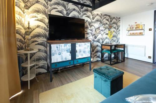 a living room with a flat screen tv on a wall at The Marina retreat -free parking in Brighton & Hove