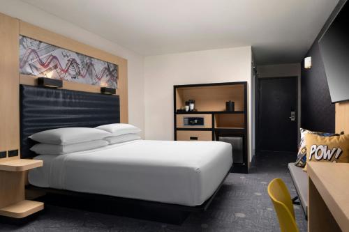 a hotel room with a bed and a desk at Aloft El Segundo - Los Angeles Airport in El Segundo