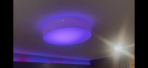 a purple light on the ceiling of a room at Apartman Banja Luka CITY in Banja Luka