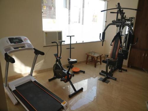 a gym with several exercise bikes in a room at LA Riqueza Pride Inn # Rootop Swimming Pool with Mountain View # Free Parking # Tapovan # Center of Rishikesh# in Rishīkesh