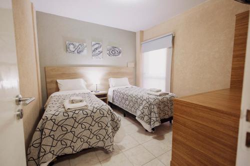 Ένα ή περισσότερα κρεβάτια σε δωμάτιο στο Apartamentos Boulevard I