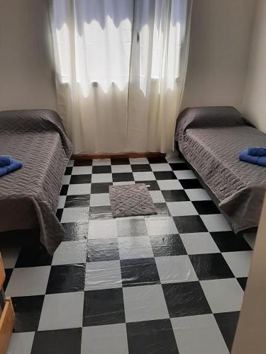 Ein Bett oder Betten in einem Zimmer der Unterkunft M&M Cipolletti